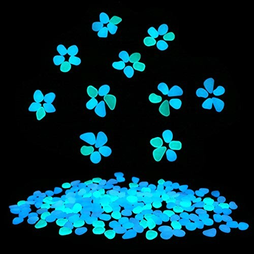 Blue and green glow in the dark stones arranged in flower shapes.