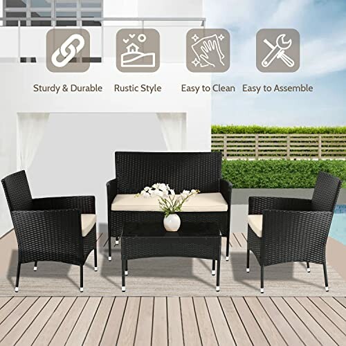 Outdoor patio furniture set with chairs, loveseat, and table on a deck.