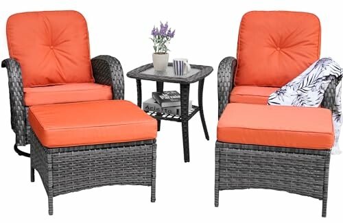 Wicker patio furniture set with orange cushions, including chairs, ottomans, and a small table.