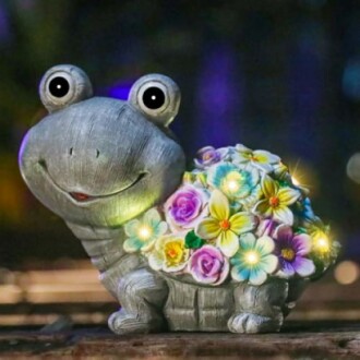 Smiling turtle figurine with colorful flower shell and glowing lights