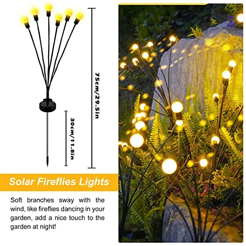 Solar fireflies lights with glowing bulbs in a garden setting.