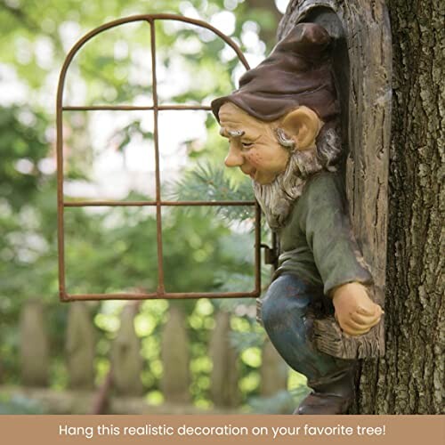 Tree gnome decoration peering out of a window on a tree trunk.